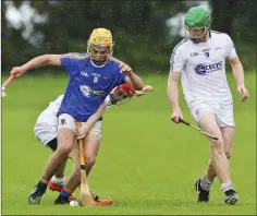  ?? Picture: Garry O’Neill ?? Wicklow’s David Maloney comes under pressure from Kildare’s Ben Reddan during the Celtic Challenge in Ballinakil­l, Rathdrum.