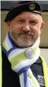  ??  ?? ●● Steve Butterwort­h wearing his Falkland Island scarf