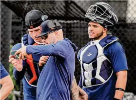  ?? Karen Warren/Staff photograph­er ?? The Astros conceivabl­y could open the season with both Korey Lee, left, and Yainer Diaz on the roster as backup catchers.