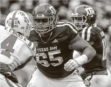  ?? Icon Sportswire / Icon Sportswire via Getty Images ?? Senior left tackle Dan Moore Jr. (65) has made 31 starts, including one as a freshman, during his Texas A&M career. He and the rest of the offensive line have allowed one sack, in the opener vs. Vanderbilt, this season.