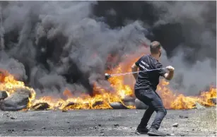  ?? (Nasser Ishtayeh/Flash90) ?? PALESTINIA­NS CLASH with Israeli soldiers during a protest against Israel’s plan to annex parts of the West Bank, in the village of Kfar Qaddum, near Nablus, last week.