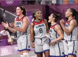  ?? Robert Gauthier Los Angeles Times ?? A JUBILANT U.S. TEAM celebrates winning the first gold in 3-on-3 basketball. From left are Stefanie Dolson, Jackie Young, Kelsey Plum and Allisha Gray.