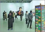  ?? PROVIDED TO CHINA DAILY ?? Finalists of the Yishu 8 Prize show their works in Beijing.