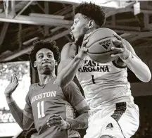  ?? Greg Thompson / Icon Sportswire via Getty Images ?? East Carolina’s Jayden Gardner, right, is averaging 17.1 points and 8.1 rebounds entering Wednesday’s game with No.5 UH.