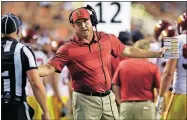  ?? [ERIC GAY/THE ASSOCIATED PRESS] ?? USC head coach Clay Helton speaks to an official during the first half against Texas on Saturday in Austin. The Trojans lost 37-16.