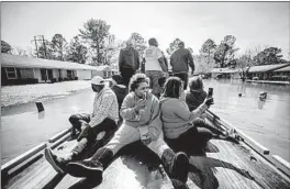  ?? CAM BONELLI/HATTIESBUR­G AMERICAN ?? to reach flooded homes Saturday in Northeast Jackson, Mississipp­i. Gov. Tate Reeves declared a state of emergency amid fears the Pearl River, which runs in the area around the capital, could burst its banks and spark widespread flooding.