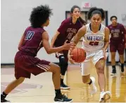  ?? Staff photos by Jason Fochtman ?? Oak Ridge guard Alyssa Gonzales (30) controls a Cy-Fair turnover as forward Oriana Gee (10) defends during the first quarter.