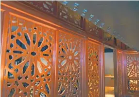  ?? KARL MERTON FERRON/BALTIMORE SUN ?? A private dining room is separated by mahogany screens.