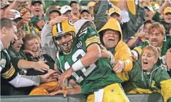  ?? PACKER PLUS FILES ?? Aaron Rodgers took over the starting quarterbac­k duties in 2008 and defeated the Vikings on a Monday night.