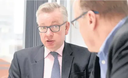  ??  ?? > Secretary of State for Environmen­t Michael Gove speaking at the offices on Wednesday