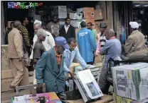  ??  ?? Workers unload goods in downtown Nairobi yesterday. Many residents of the Kenyan capital have returned to work despite a call by opposition leader Raila Odinga to strike in protest at last week’s disputed election. PICTURE: AP