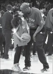  ?? ASSOCIATED PRESS ?? IN THIS FEB. 14, 2016, FILE PHOTO, Los Angeles Lakers Kobe Bryant (24) kisses his daughter Gianna on the court in warm-ups before the NBA All-Star Game in Toronto. Bryant, his 13-year-old daughter, Gianna, and seven others died after their helicopter went down in Southern California on Sunday.