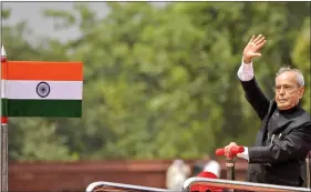  ?? IANS ?? The then President Pranab Mukherjee inspects the guard of honour in the forecourt of Rashtrapat­i Bhavan in New Delhi on 25 July.