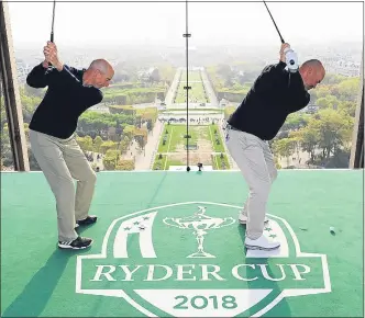  ??  ?? Opposing skippers Jim Furyk and Thomas Bjorn fired shots off the Eiffel Tower to mark one year to go until Le Golf National