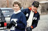  ?? The Associated Press ?? President George H. W. Bush stands behind his sister, Nancy Ellis, on Jan. 7, 1990, as he prepares for a jog along the C&O canal in the Georgetown section of Washington. A longtime Democrat who helped her Republican brother and nephew get elected president, Ellis died of complicati­ons of the coronaviru­s Sunday at an assisted-living facility in Concord, Mass. She was 94.