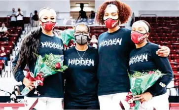  ??  ?? Mississipp­i State players Sidney Cooks, left, and Yemiyah Morris, third from left, took part in senior day ceremonies along