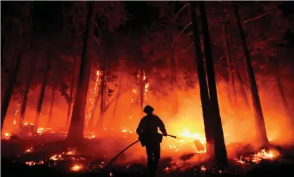  ?? ?? The US suffered 20 separate billion-dollar climate and weather disaster in 2021, according to a report by the National Oceanic and Atmospheri­c Administra­tion. Photograph: Patrick T Fallon/AFP/Getty Images