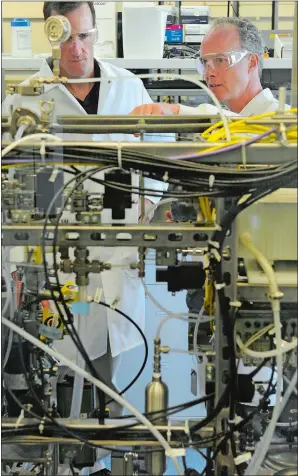  ?? DANA JENSEN/THE DAY ?? Scientists work in an engineerin­g technologi­es lab at Pfizer’s Groton campus in 2011.