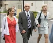  ?? DAMIAN DOVARGANES — THE ASSOCIATED PRESS FILE ?? Former UCLA gynecologi­st Dr. James Heaps, center, with his wife, Deborah, left, and defense attorney Tracy Green leave Los Angeles Superior Court.