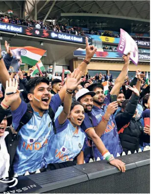  ?? GETTY IMAGES ?? Cheering on: Fans cheer for India at Adelaide Oval during the T20 World Cup clash between India and Bangladesh. Indian fans have filled up stadiums wherever the team has played.