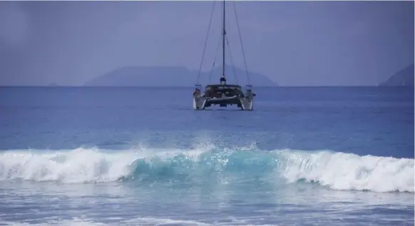  ?? SHARON MATTHEWS-STEVENS FOR THE TORONTO STAR ?? A wave breaks ashore off Tortola in the British Virgin Islands. In the background, Deadchest Island — made famous by the pirate ditty — lurks along the southern horizon.