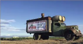  ?? PHOTOS BY GILLIAN FLACCUS — ASSOCIATED PRESS ?? An advertisem­ent for a festival built around the Aug. 21total solar eclipse sits alongside a busy road leading into Madras, Oregon on June 13. The first place to experience total darkness as the moon passes between the sun and the Earth will be in...