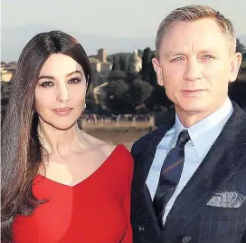  ?? Picture: VITTORIO ZUNINO CELOTTO/ GETTY ?? Star Daniel Craig with Monica Bellucci who plays a Bond girl in Spectre