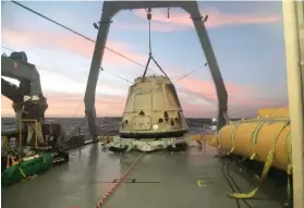  ?? AP PHOTO/SPACEX ?? TO THE MOON. In this file photo, the Dragon capsule of SpaceX sits aboard a ship in the Pacific Ocean west of Mexico’s Baja Peninsula after returning from the Internatio­nal Space Station. Two paying customers would go to the moon on a private flight...