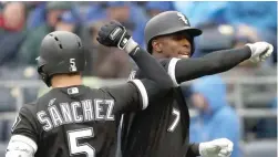  ?? GETTY IMAGES ?? Tim Anderson is congratula­ted by Yolmer Sanchez after hitting a solo home run in the fourth inning. Anderson also hit a two- run homer in the fifth inning.