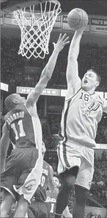  ?? Larry W. Smith EPA ?? THE LAKERS’ Wesley Johnson tries to block a shot from San Antonio’s Aron Baynes during the first half of a game Friday.