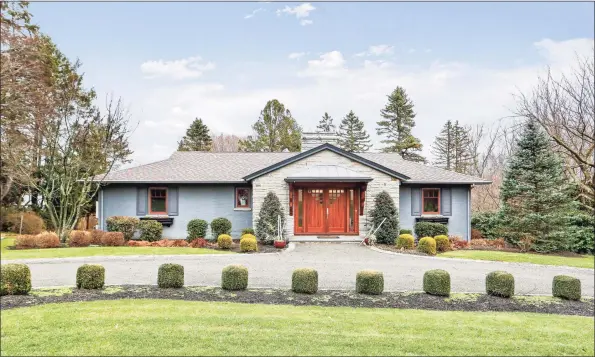  ?? Contribute­d photos ?? The home, located in a quiet country setting, features five bedrooms and four full and one half baths, including a lower- level in- law suite with an elevator.