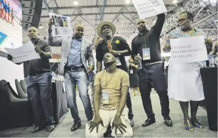  ?? Picture: Jacques Nelles ?? REENACTMEN­T. ANC councillor­s disrupt the State of The Capital address yesterday in Pretoria by commemorat­ing the 1979 execution of Solomon Mahlangu.