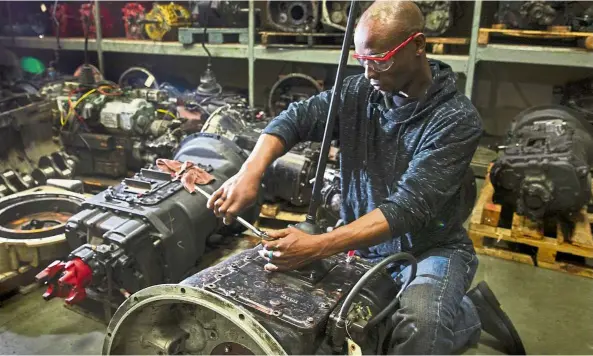  ??  ?? Carneh, a student at Bates Technical College in the US diagnoses a roadranger in his diesel engine class at the college. — Photos: Seattle Times/ Tribune News Service