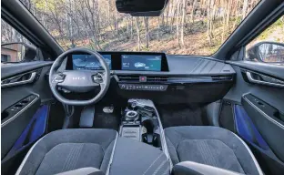  ?? KIA ?? The EV6 mixes high-tech content such as a digitized dashboard with practical elements such as a floating centre console with abundant storage solutions and a large bin underneath it.