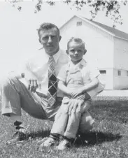  ?? Courtesy Kuiper family ?? Henry J. Kuiper with son Duane, now a Giants broadcaste­r, on the family farm in Racine, Wisc.