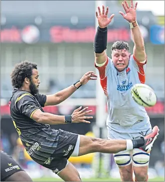  ?? ?? Edinburgh’s Grant Gilchrist attempts to charge down Sharks’ Jaden Hendrikse’s kick.