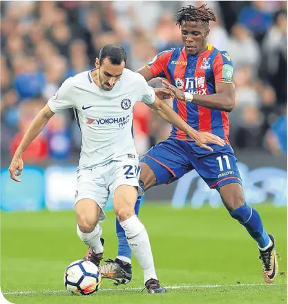  ??  ?? Chelsea’s Davide Zappacosta and Crystal Palace match-winner Wilfried Zaha battle for the ball