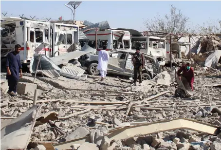  ?? AFP ?? Afghan security forces investigat­e the site where a car bomb detonated on Thursday near an intelligen­ce services building in Qalat in Zabul province.