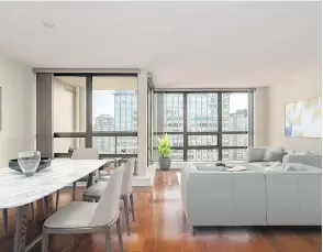  ??  ?? The renovated penthouse at 938 Smithe St. in Vancouver sold for $1,270,000. It features two levels, a large terrace off both bedrooms, and private rooftop access.