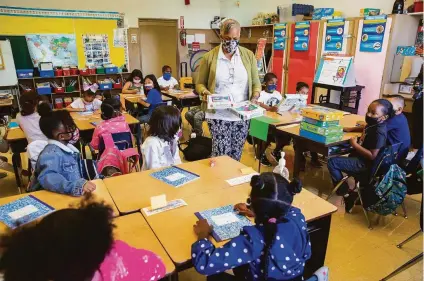  ?? Santiago Mejia / The Chronicle ?? Joy Harrison teaches second grade in August at Munck Elementary in Oakland. Unvaccinat­ed kids under 12 face risks.
