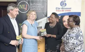  ?? GLADSTONE TAYLOR/PHOTOGRAPH­ER ?? Rosemary Dodd (second left) receives a copy of ‘Six Great Jamaicans’ from Minister of Culture, Gender, Entertainm­ent and Sport Olivia Grange (second right) as Beverley Lashley (right), national librarian and chief executive officer, National Library of Jamaica, and Simon Costa, great-great-grandson of Archbishop Enos Nuttall, look on during the ‘Six Great Jamaicans’ book launch, held last Thursday at The Gleaner’s North Street, Kingston, ofiices.