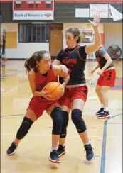  ?? PHOTOS BY JENNIFER ELLIS/RIVER VALLEY & OZARK EDITION ?? Russellvil­le senior Sara Velazquez tries to power past junior Gracie Campbell during a scrimmage Wednesday. Head coach Ryan Koerdt said Velazquez has a knack for playing bigger than she is.