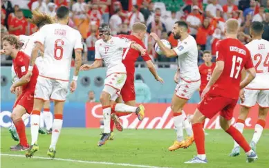  ?? — Reuters ?? The ball appears to hit the arm of Tunisia’s Yassine Meriah before referee Cesar Arturo Ramos checks the VAR screen and rules it accidental and no penalty.