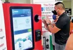  ?? ?? San Juan City Mayor Francis Zamora testing the Reverse Vending Machine (RVM) for San Juan’s recycling efforts. (Photo from Mayor Francis Zamora’s Facebook page)