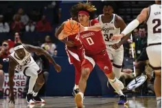  ?? The Associated Press ?? ■ Arkansas guard Anthony Black passes against Texas A&M Friday in Nashville, Tenn.