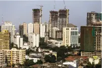  ?? — FILE PHOTO ?? Towers under constructi­on in Mumbai.