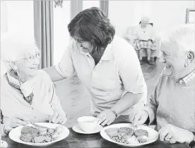  ?? DREAMSTIME ?? Happy seniors share a meal in a retirement residence. For many Canadian seniors, the picture is not so bright, writes Bill Sullivan. Government­s, especially at the federal level, need to do much more to keep pace with growing demand.