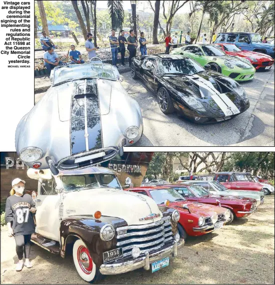  ?? MICHAEL VARCAS ?? Vintage cars are displayed during the ceremonial signing of the implementi­ng rules and regulation­s of Republic Act 11698 at the Quezon City Memorial Circle yesterday.
