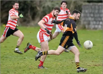  ?? Photo by Domnick Walsh ?? Dale Counihan, Austin Stacks B, shoots for a score as Kilgarvan’s Shane O’Sullivan attempts to challenge him during Sunday’s County SFL Division 5 Group A game in Connolly Park Tralee .