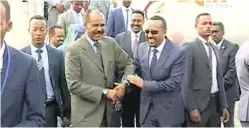  ?? PICTURE: ERITV/ AP ?? In this grab taken from video provided by ERITV, Ethiopia’s Prime Minister Abiy Ahmed, centre right is welcomed by Erirea’s President Isaias Afwerki as he disembarks a plane, in Asmara, Eritrea, yesterday.